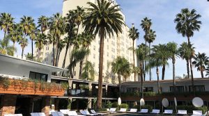 Facade of The Hollywood Roosevelt hotel in Los Angeles, showcasing its historic Spanish Colonial Revival architecture along Hollywood Boulevard.