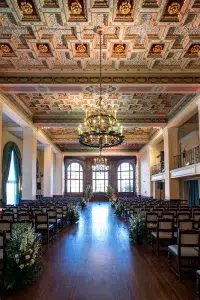 best indoor wedding venues in california Elegant historic ballroom at The Ebell of Los Angeles with chandeliers and classic architectural details.