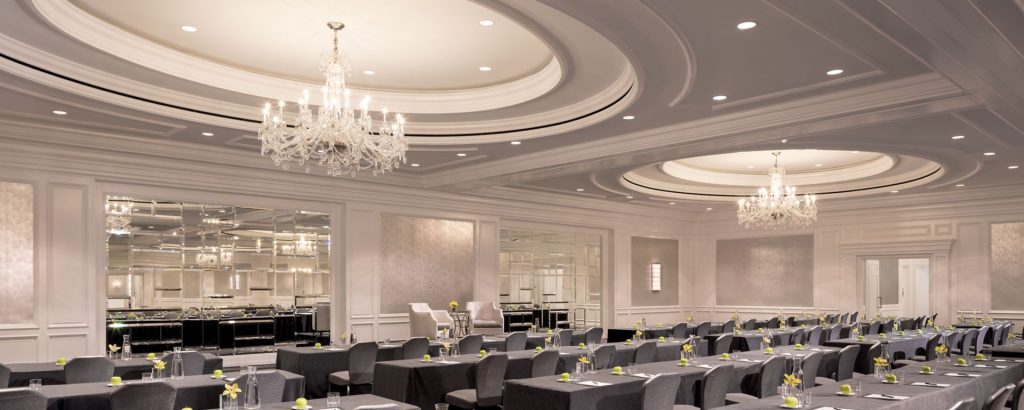 best indoor wedding venues in california Lavish ballroom at The Ritz-Carlton, San Francisco with crystal chandeliers and elegant wedding setup