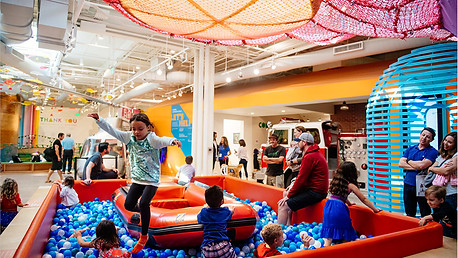 Children playing in the interactive play zone at the Cayton Children’s Museum in Santa Monica during a 1st birthday celebration.